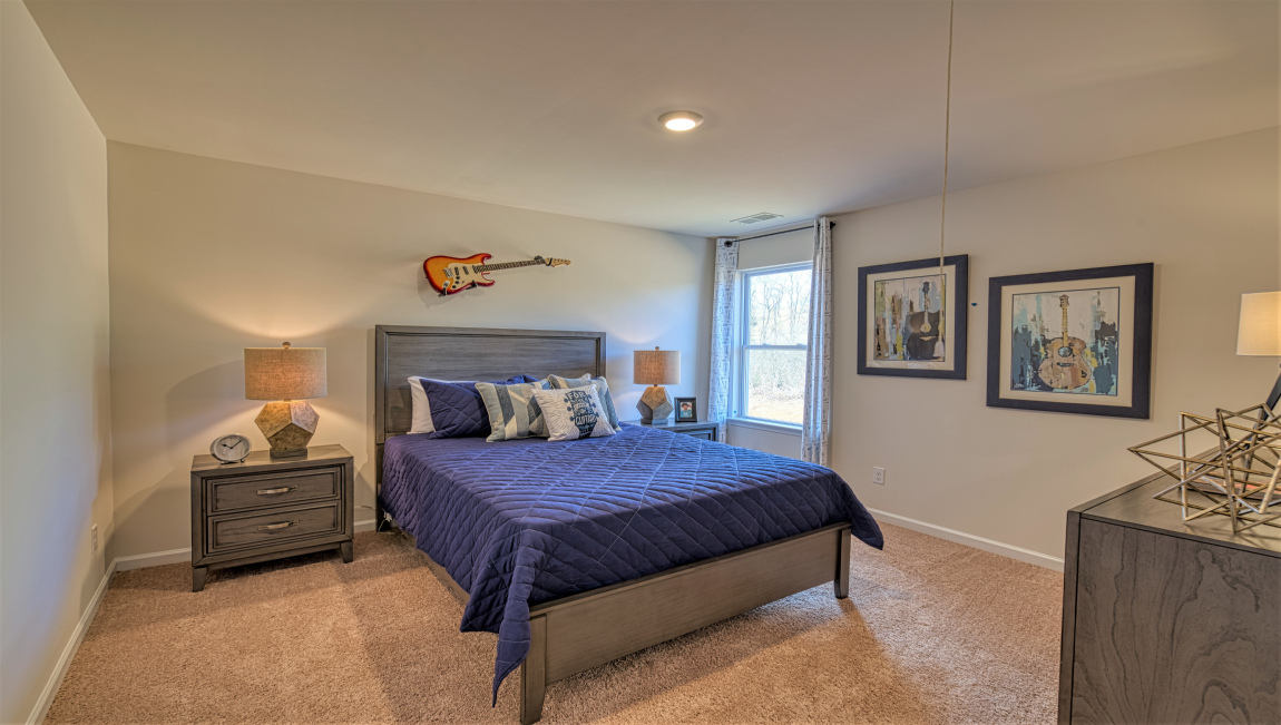 Carpeted bedroom with window