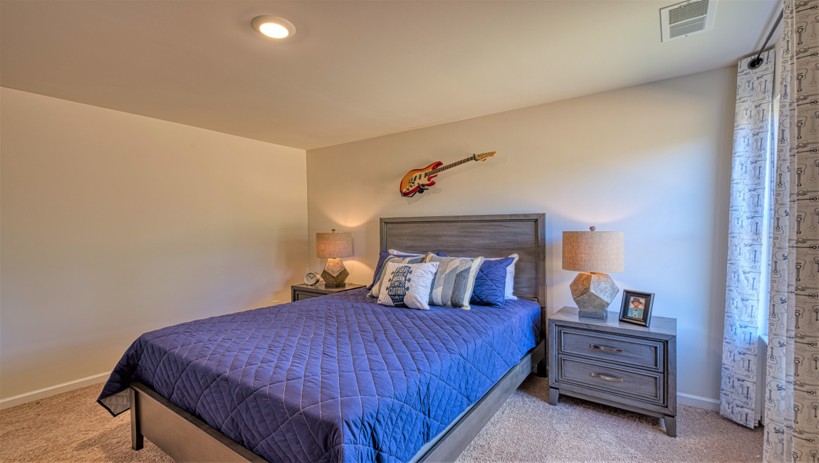 Carpeted bedroom with window