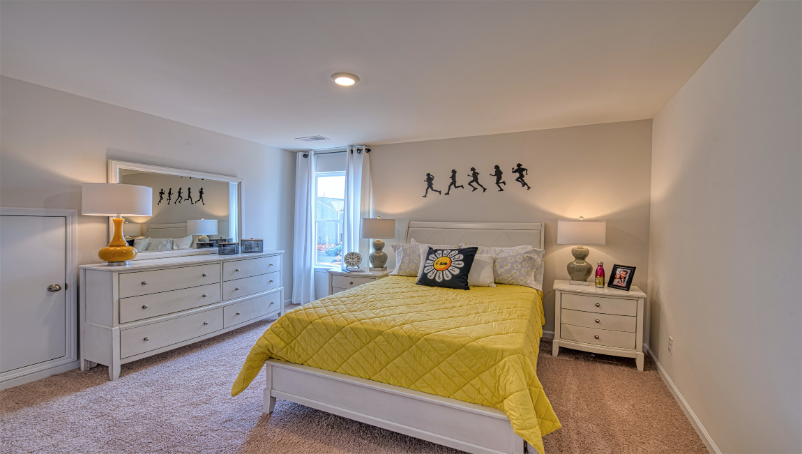 Carpeted bedroom with window