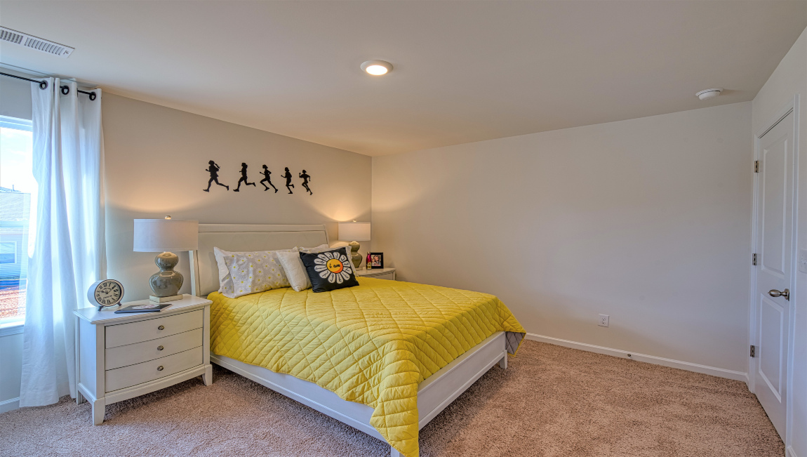 Carpeted bedroom with window