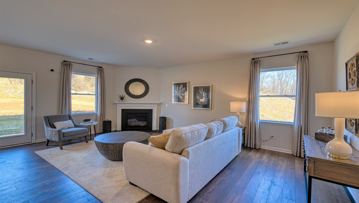 Open concept living area with windows