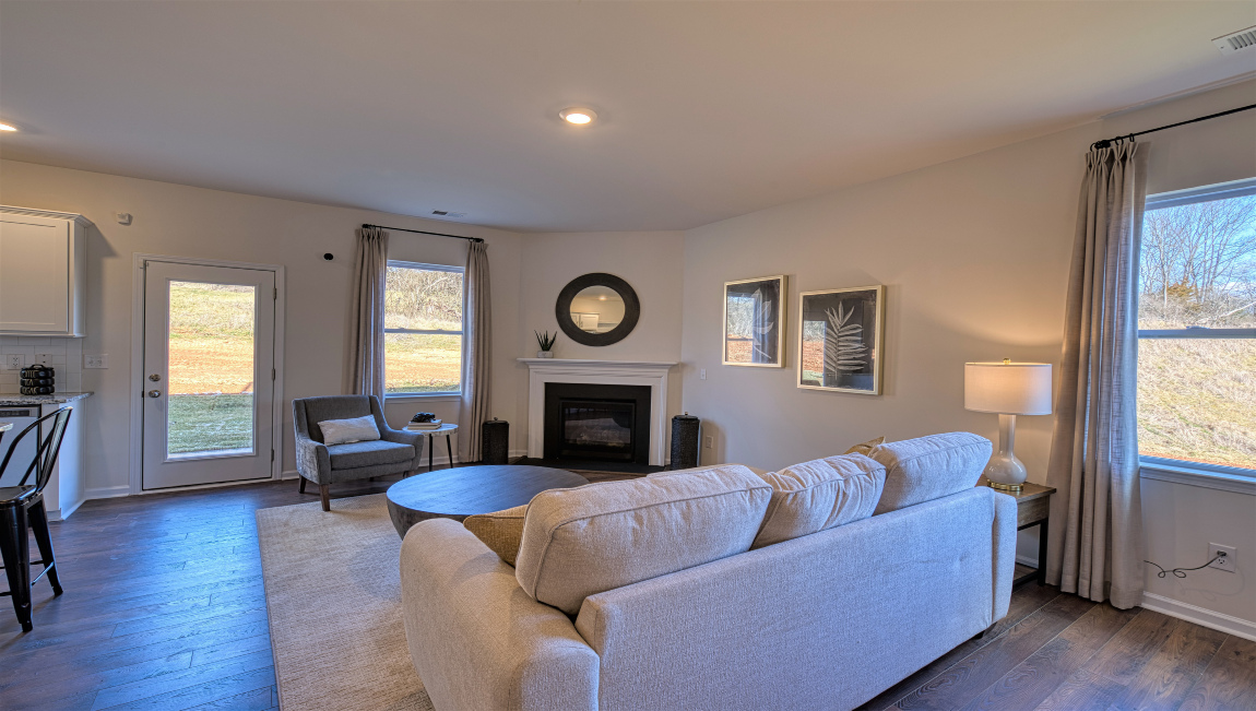 Open concept living area with windows