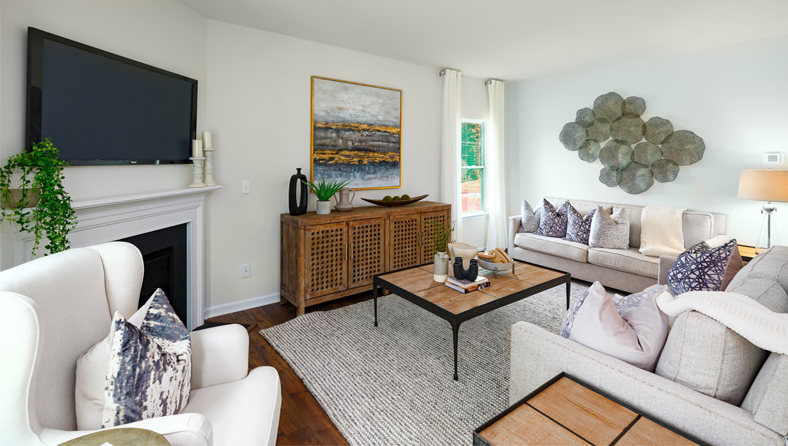 Open living area with gas fireplace and windows