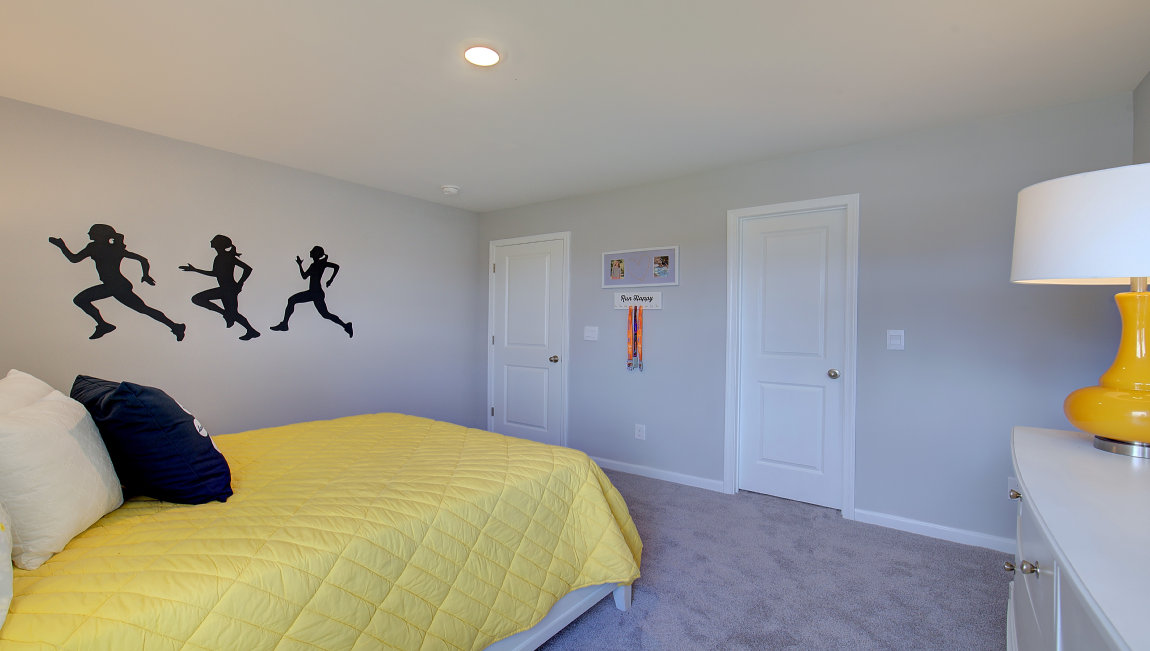 Carpeted bedroom with large window