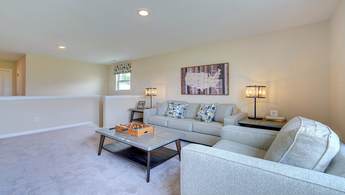 Upstairs loft area with large window