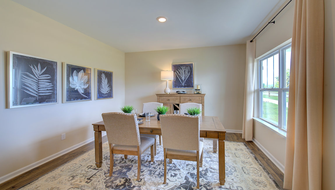 Formal dining room with large windows
