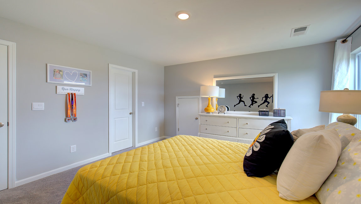 Capeted bedroom with large windows