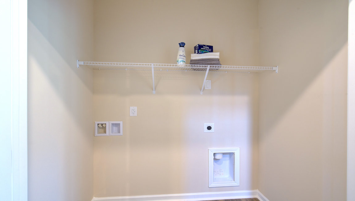 Laundry room with shelving
