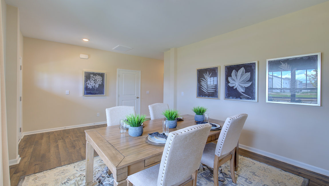 Formal dining room with large windows