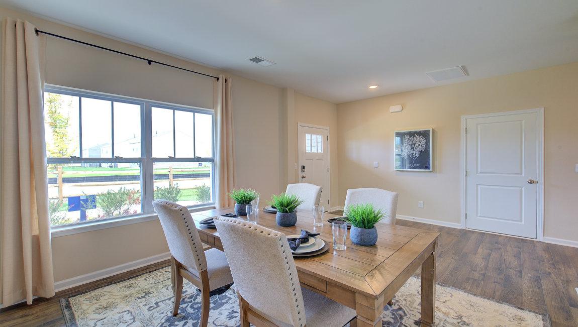 Formal dining room with large windows