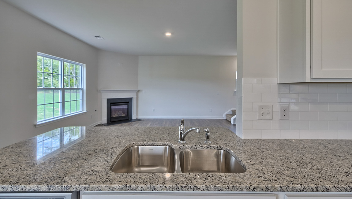 Open kitchen with island and stainless steel appliances