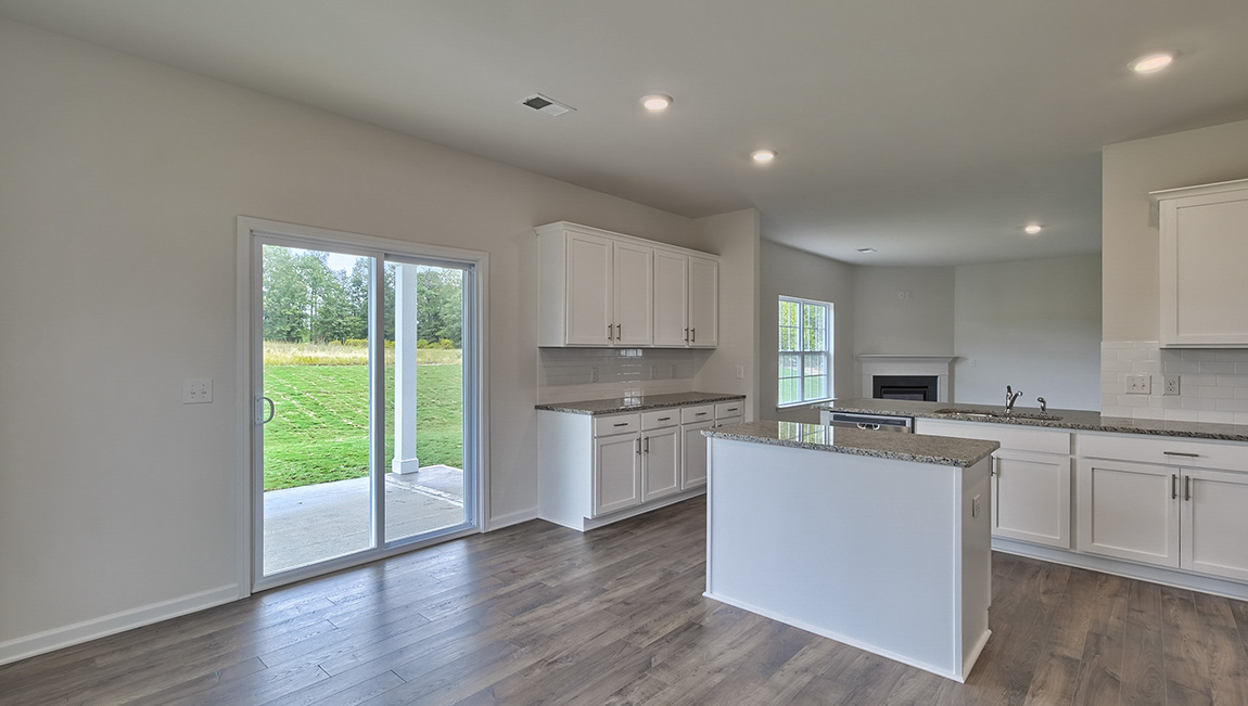 Open kitchen with island and stainless steel appliances