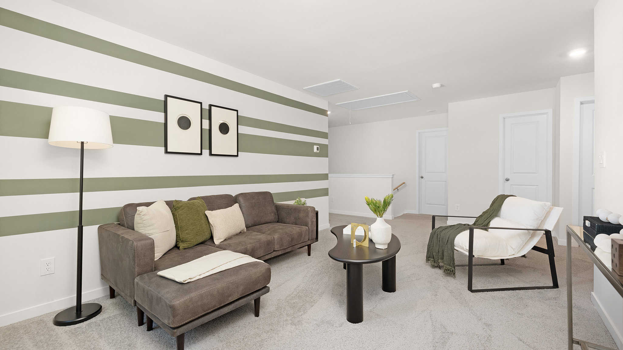 Carpeted bedroom with windows