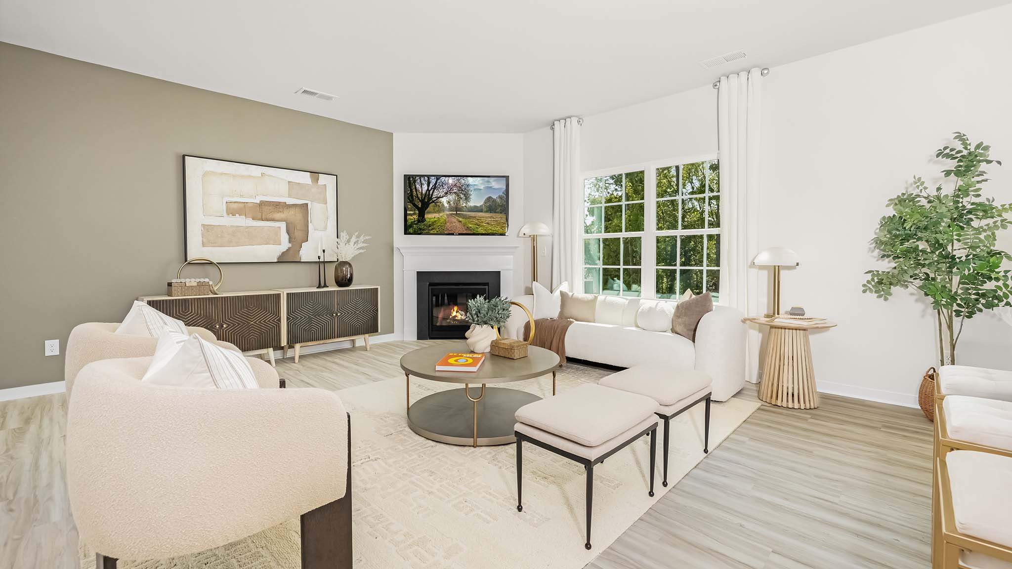 Open living area with gas fireplace and large window