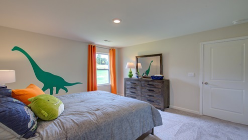 Carpeted bedroom with large window