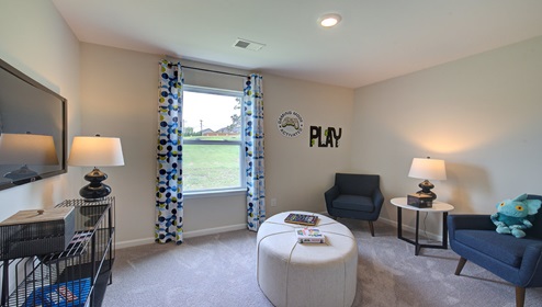 Carpeted bedroom with large window