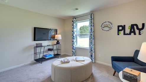 Carpeted bedroom with large window