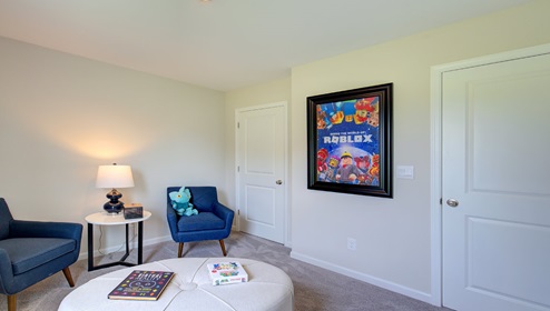 Carpeted bedroom with large window