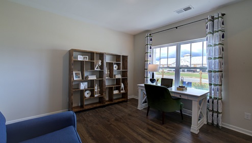 Office space with vinyl floors and large window