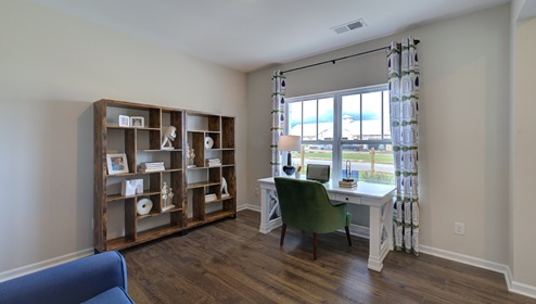 Office space with vinyl floors and large window