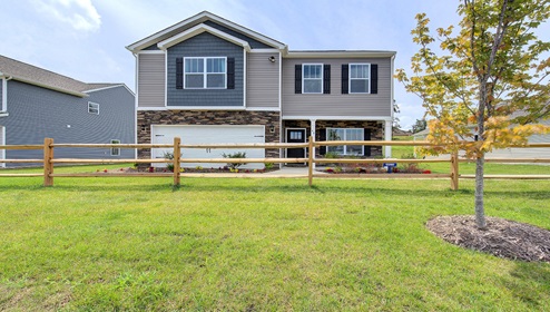 Penwell k front exterior with siding and a 2 car garage