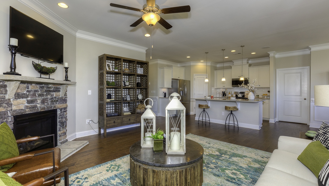 Living room space with large window and fireplace