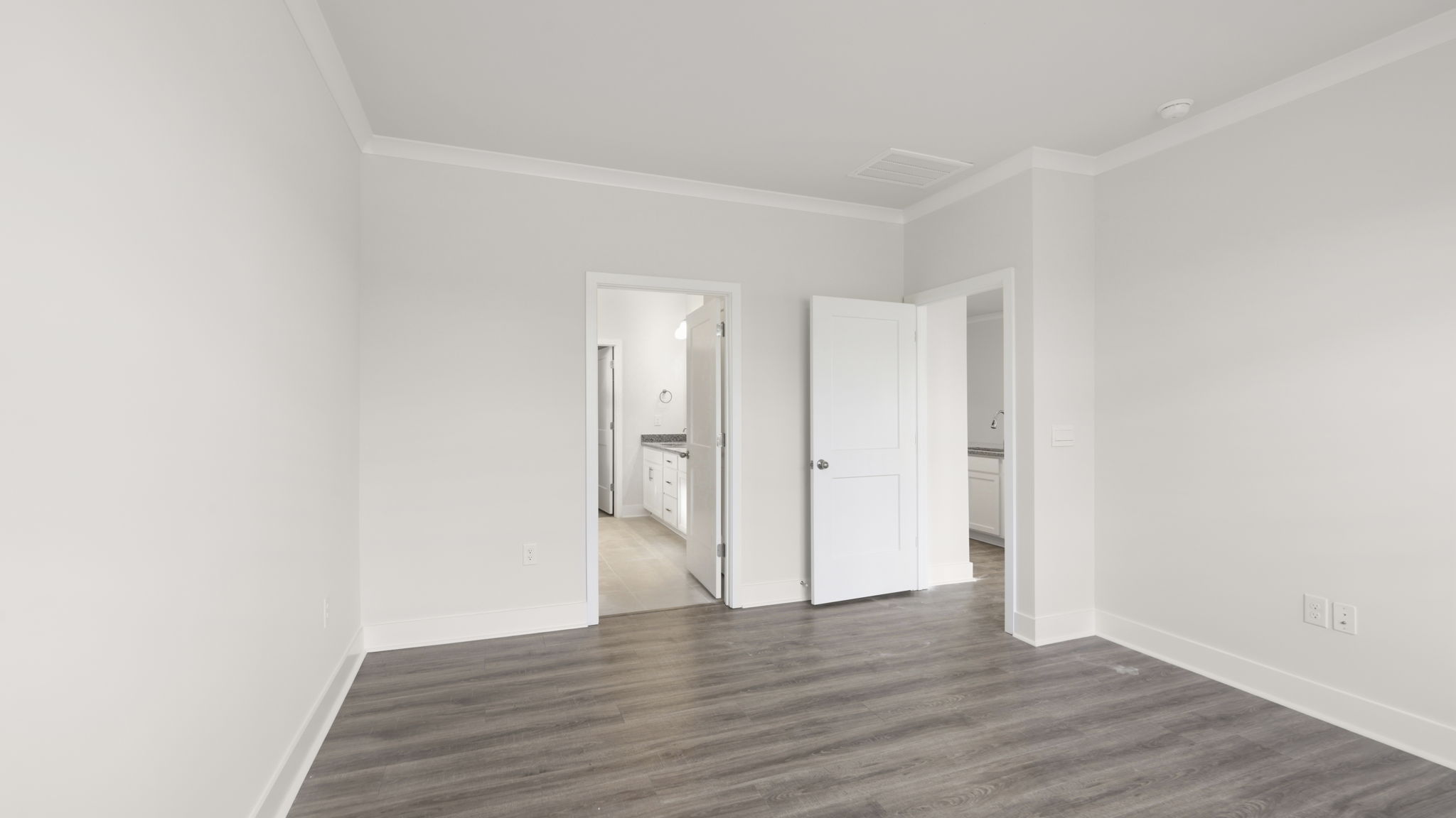 Bedroom with white walls and large window