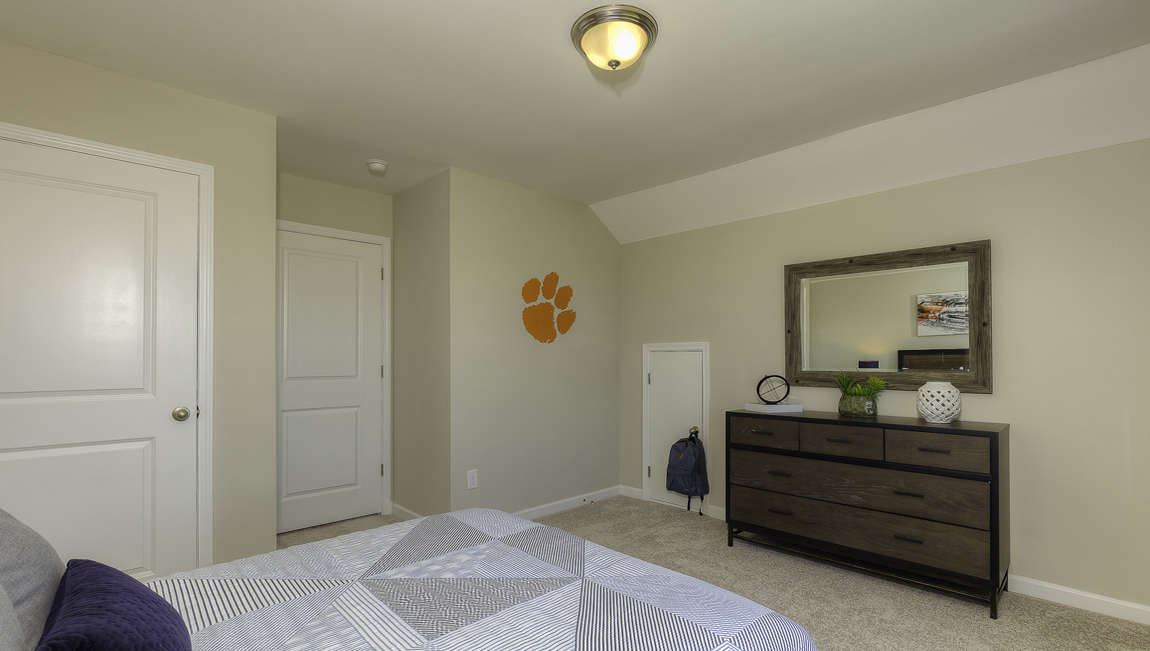 Carpeted bedroom with two windows