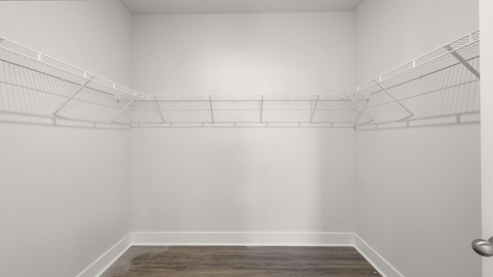 Large walk in closet with built in shelving