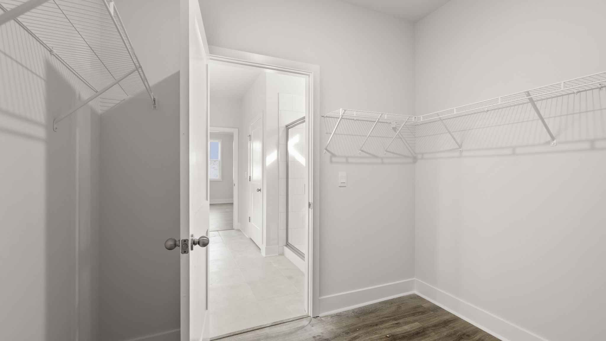 Large walk in closet with built in shelving