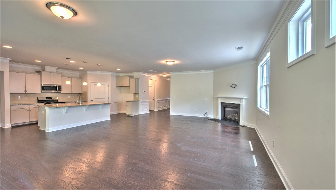Open living area with large windows and fireplace