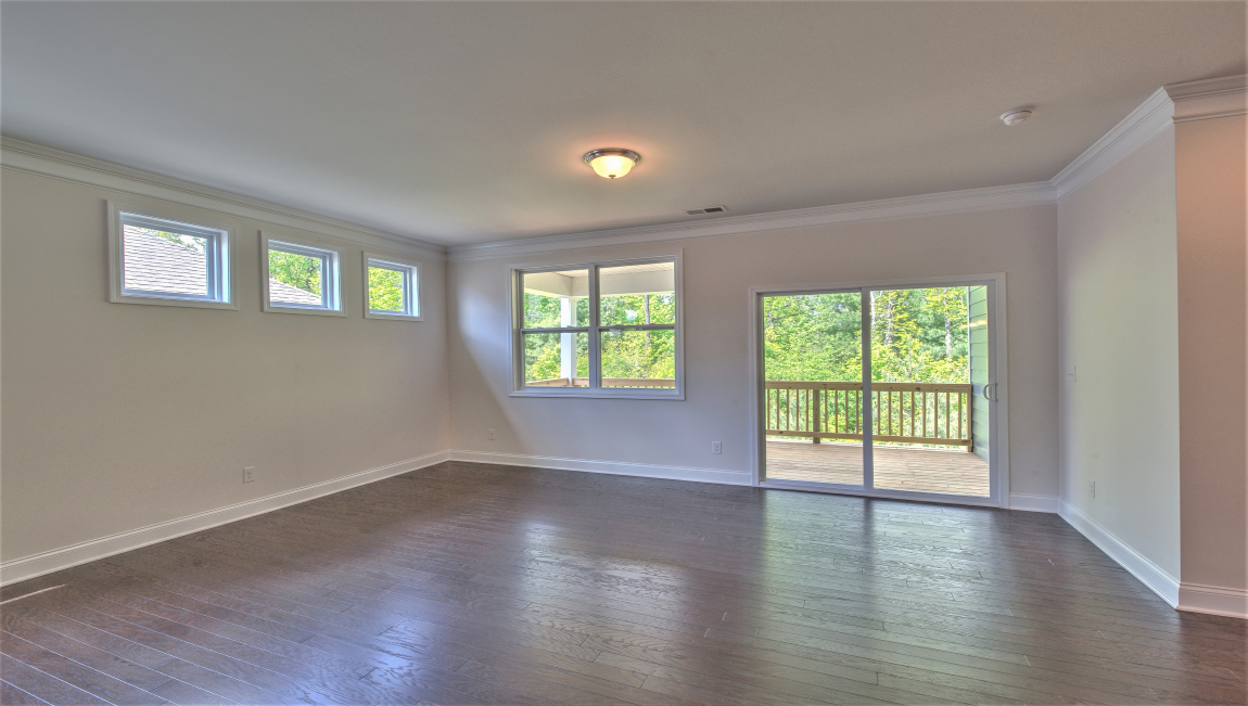 Open living area with large windows and fireplace