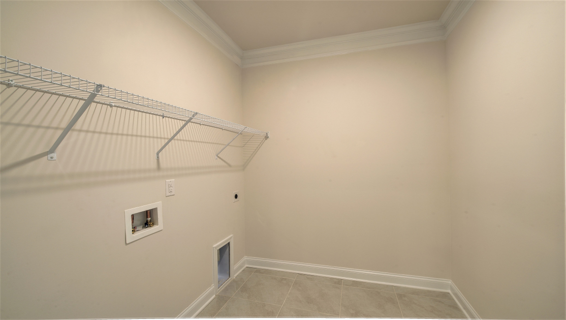 Laundry room with shelving