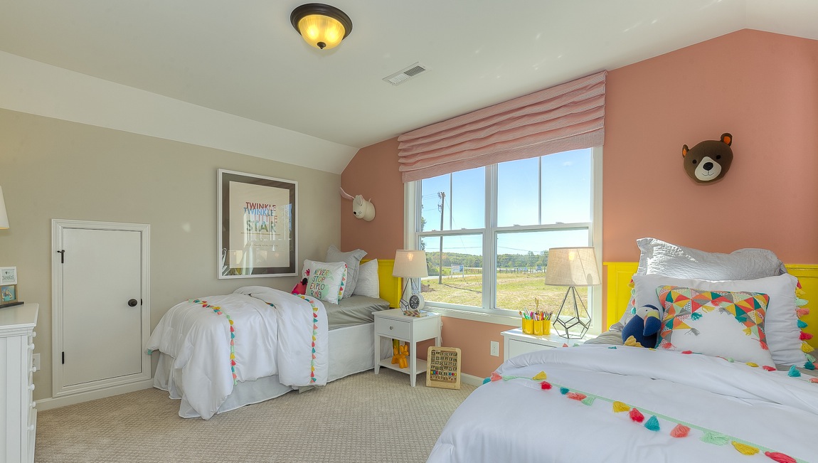 Carpeted bedroom with large window