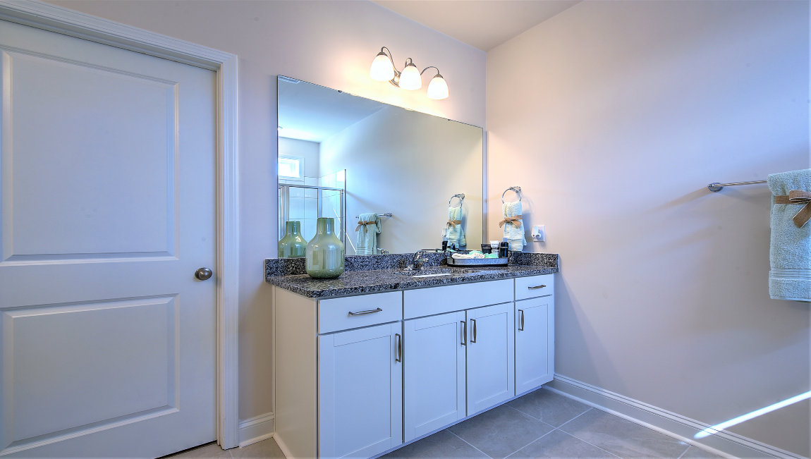 Primary bathroom with two vanities