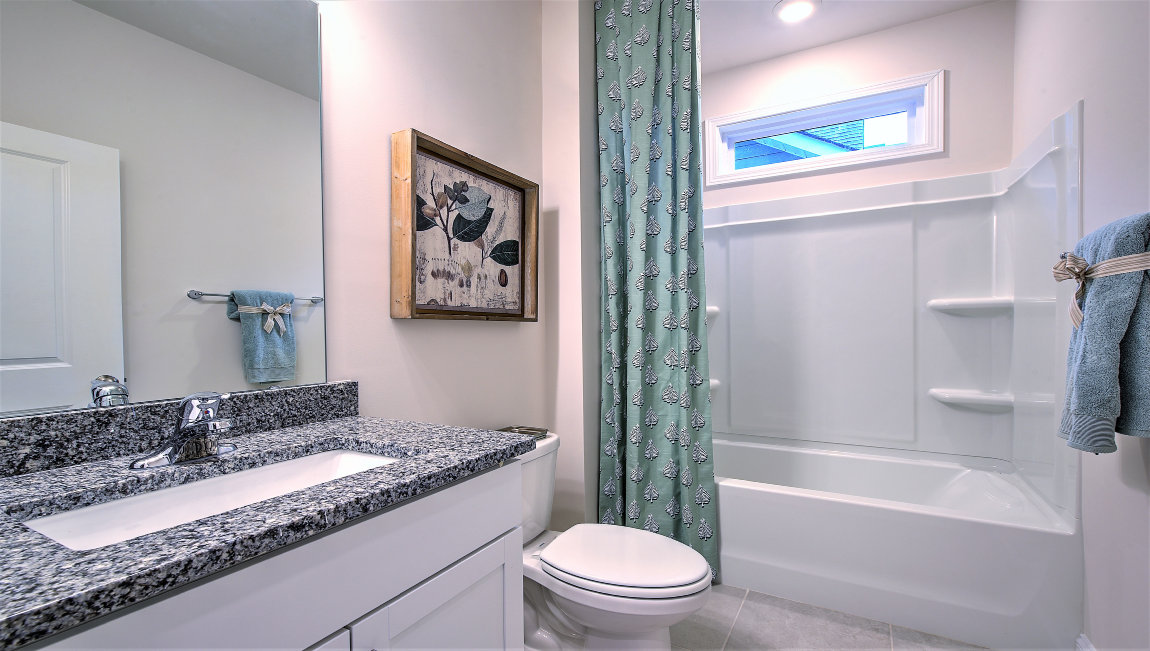 Bathroom with single vanity and bathrub