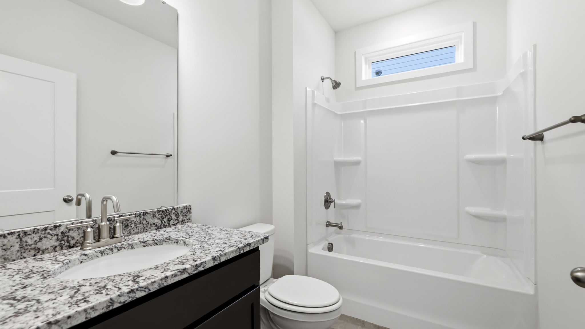 Bathroom with vanity and bathtub