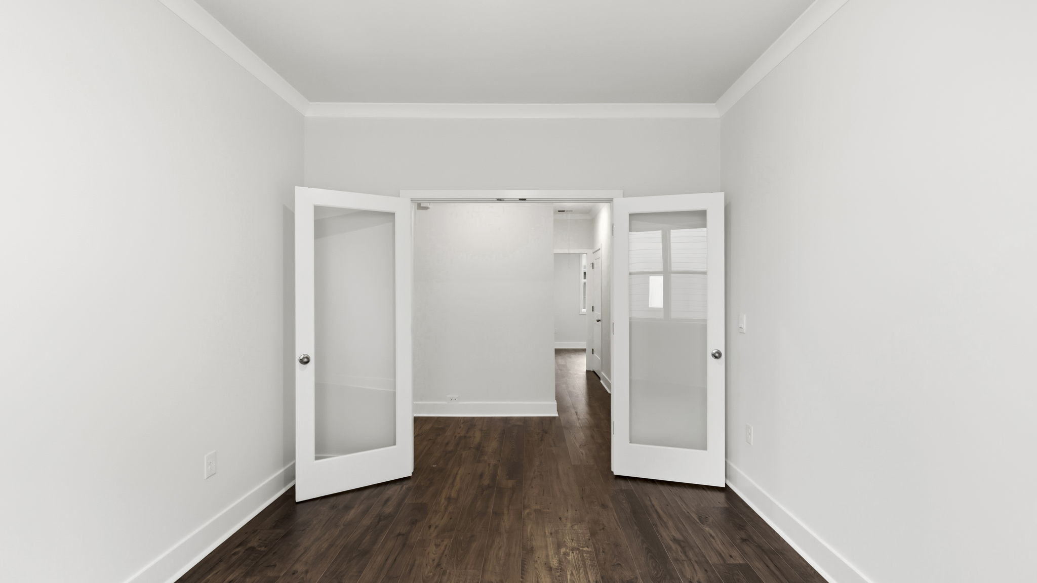 Study with glass doors and large window