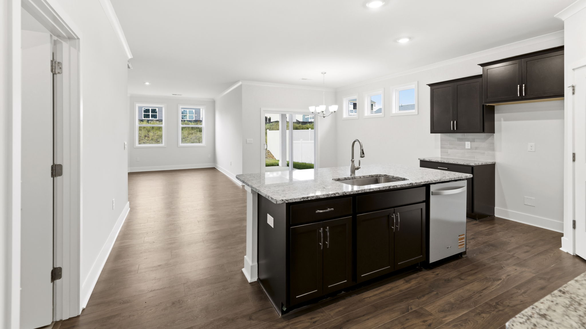 Open concept kitchen with large island and stainless steel appliances