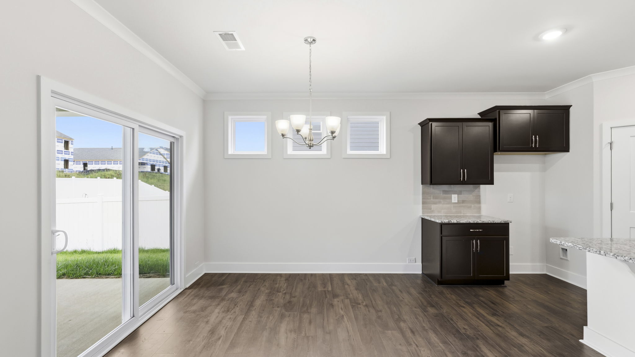 Open concept living area with gas fireplace and sliding glass doors
