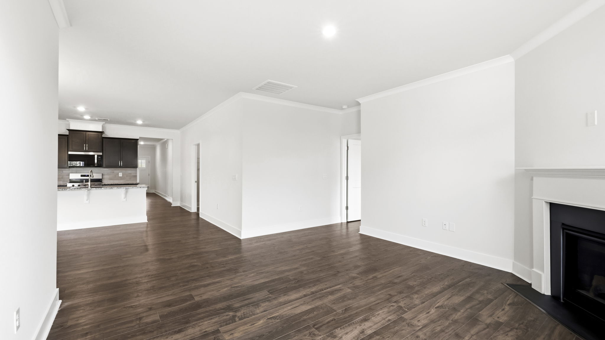 Open concept living area with large windows and gas fireplace