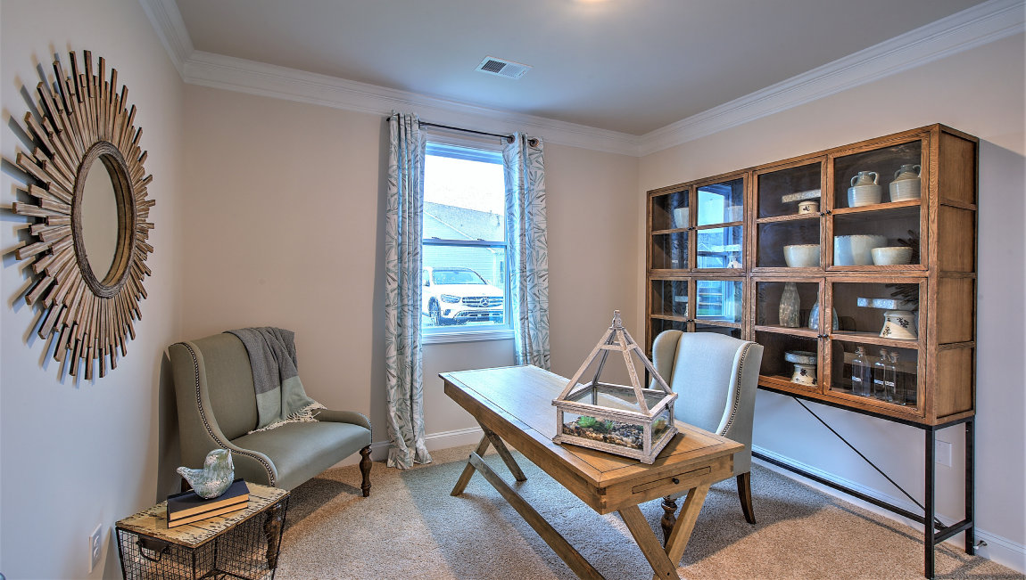 Carpeted office/flex space with small window