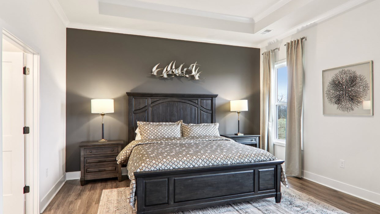 Primary bedroom with accent wall