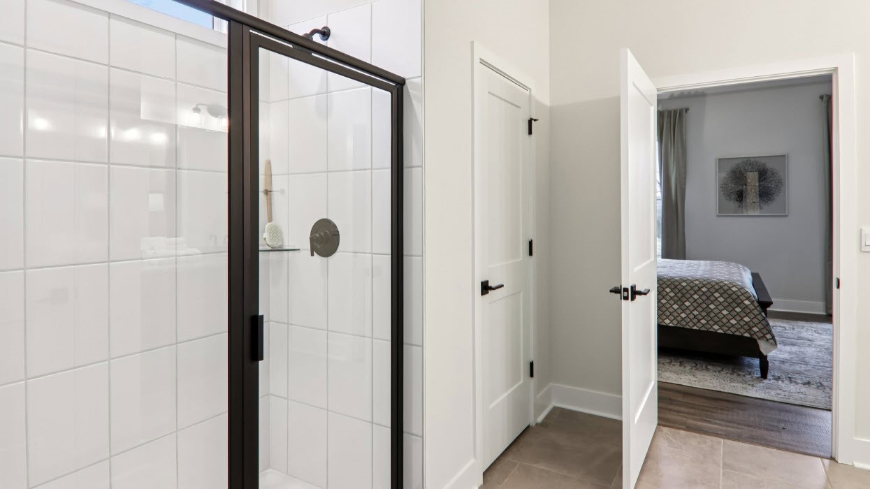 Primary bathroom with double vanity and walk in shower