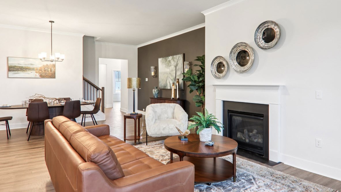 Great room with large windows and fireplace