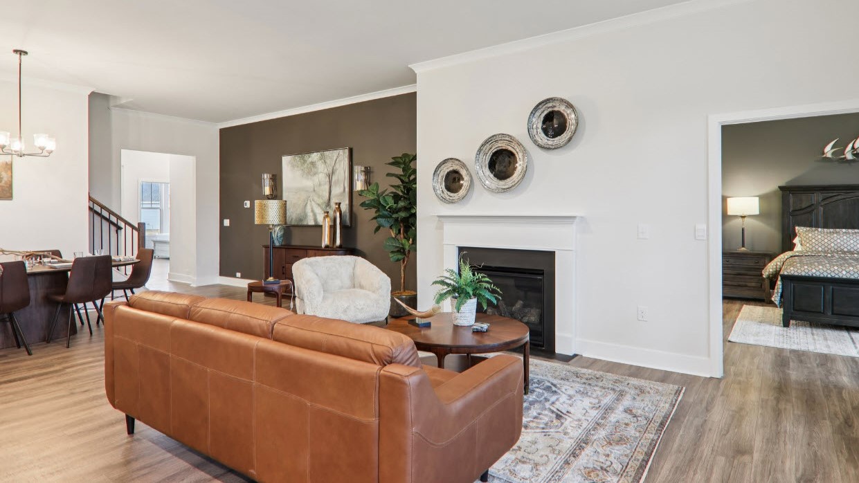 Great room with large windows and fireplace
