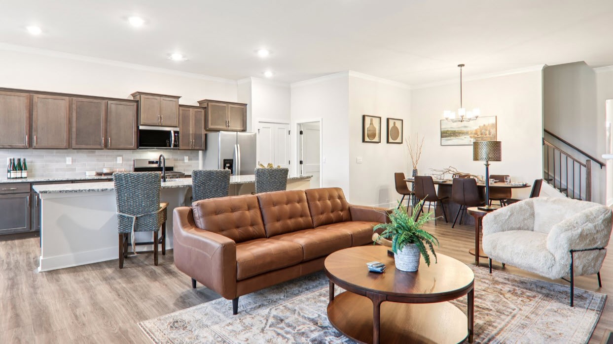 Great room with large windows and fireplace