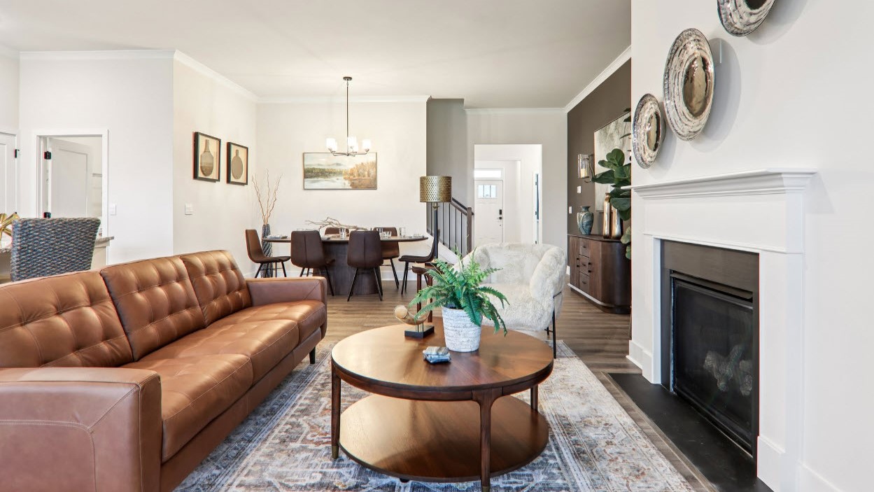 Great room with large windows and fireplace