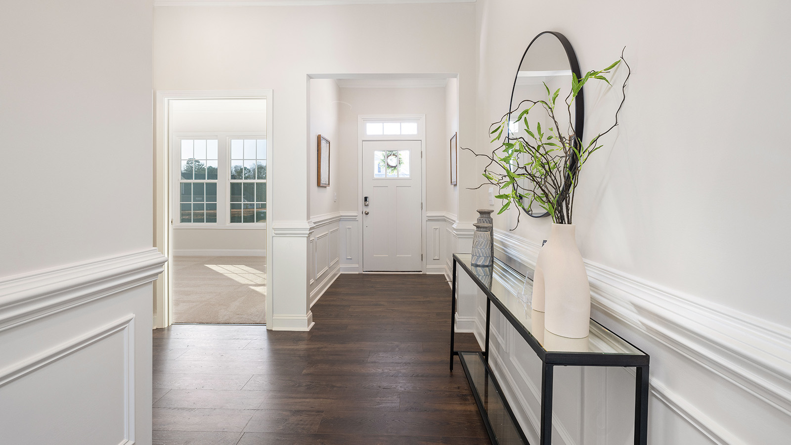Welcoming foyer with wood floors