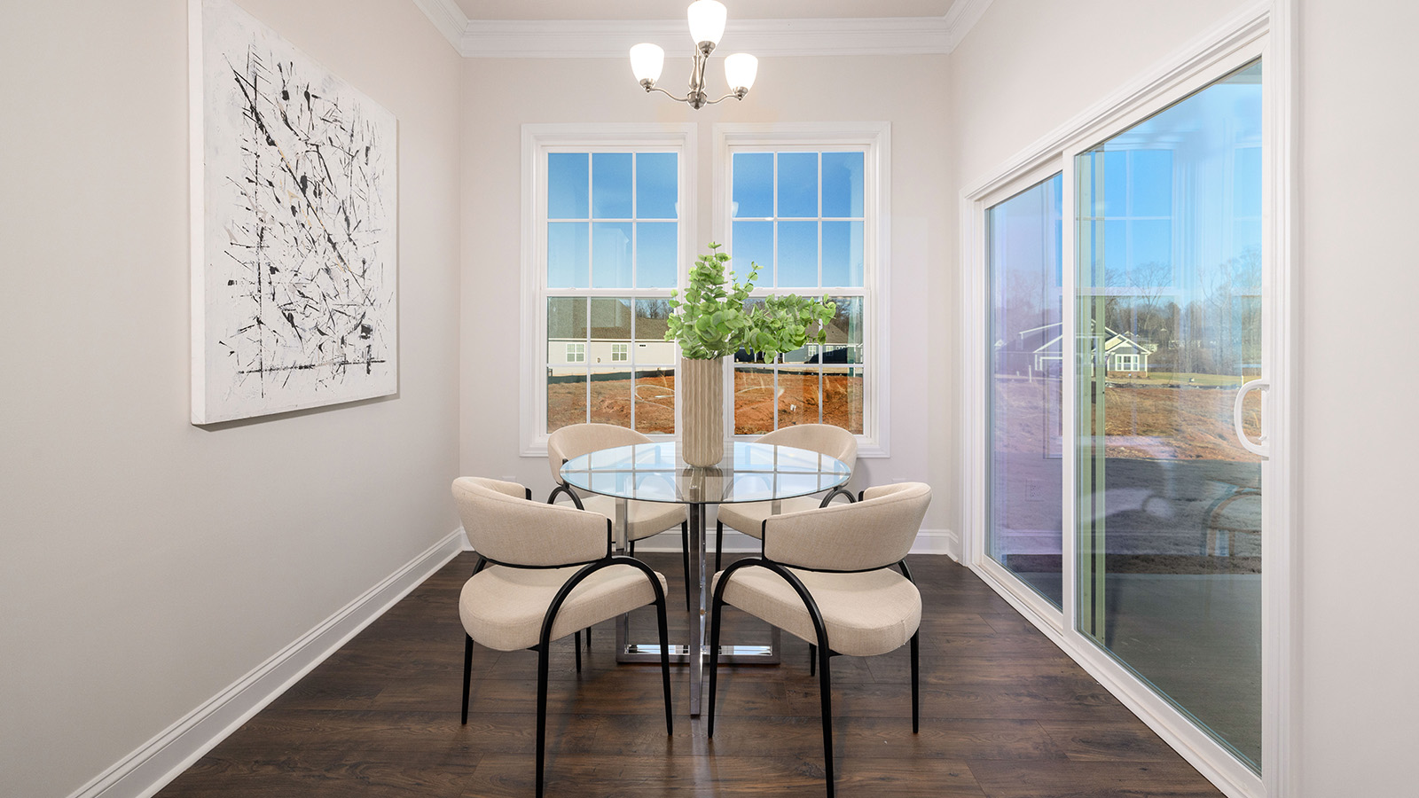 Dining area with wood floors and view of foyer